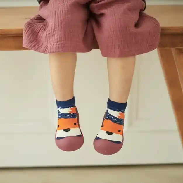 Toddler sitting on the bench wearing sock shoes by BigToes Australia -  baby pre-walker first baby sock shoes