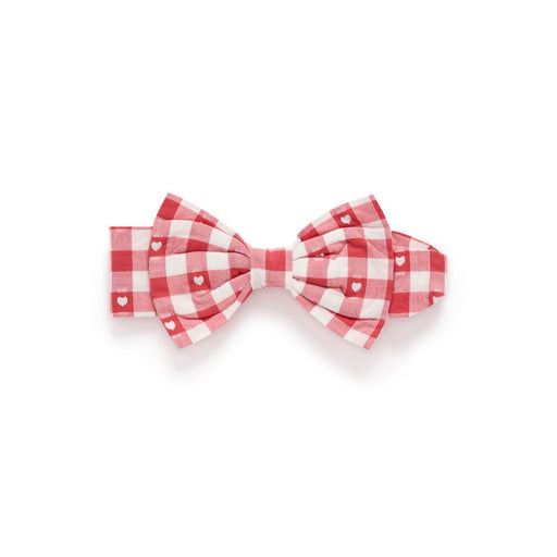 Red and white checkered bow tie on a white background