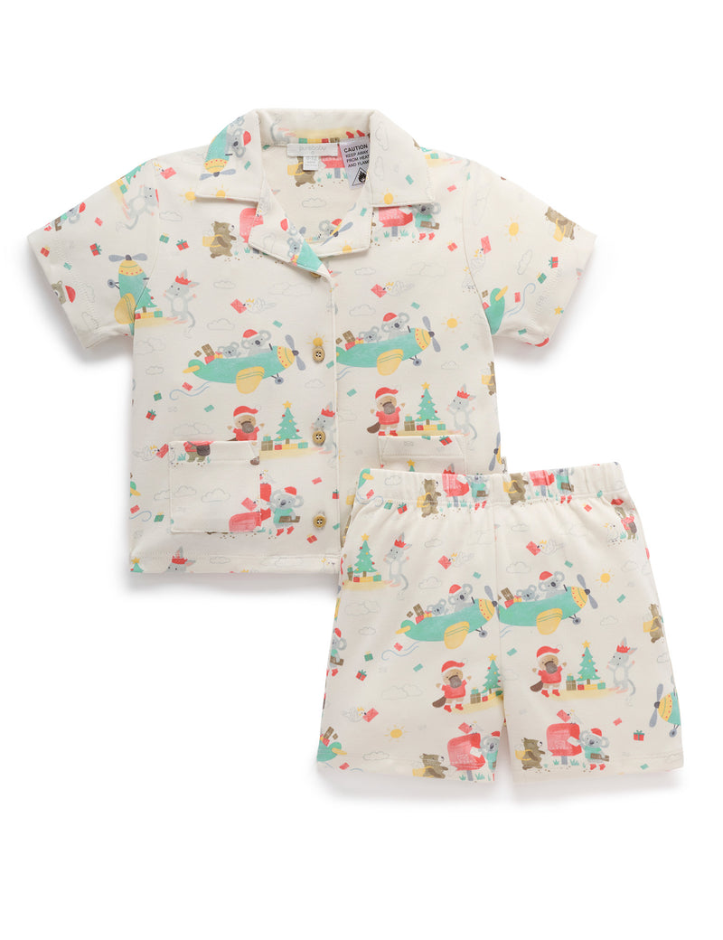 Children's outfit with patterned shirt and shorts on a white background