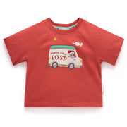 Red children's t-shirt with a North Pole post truck graphic on a white background